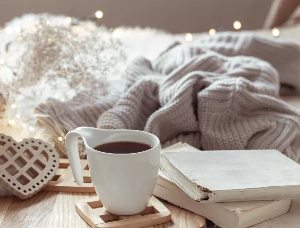 cozy-composition-with-cup-coffee-saucer-home-decor-details